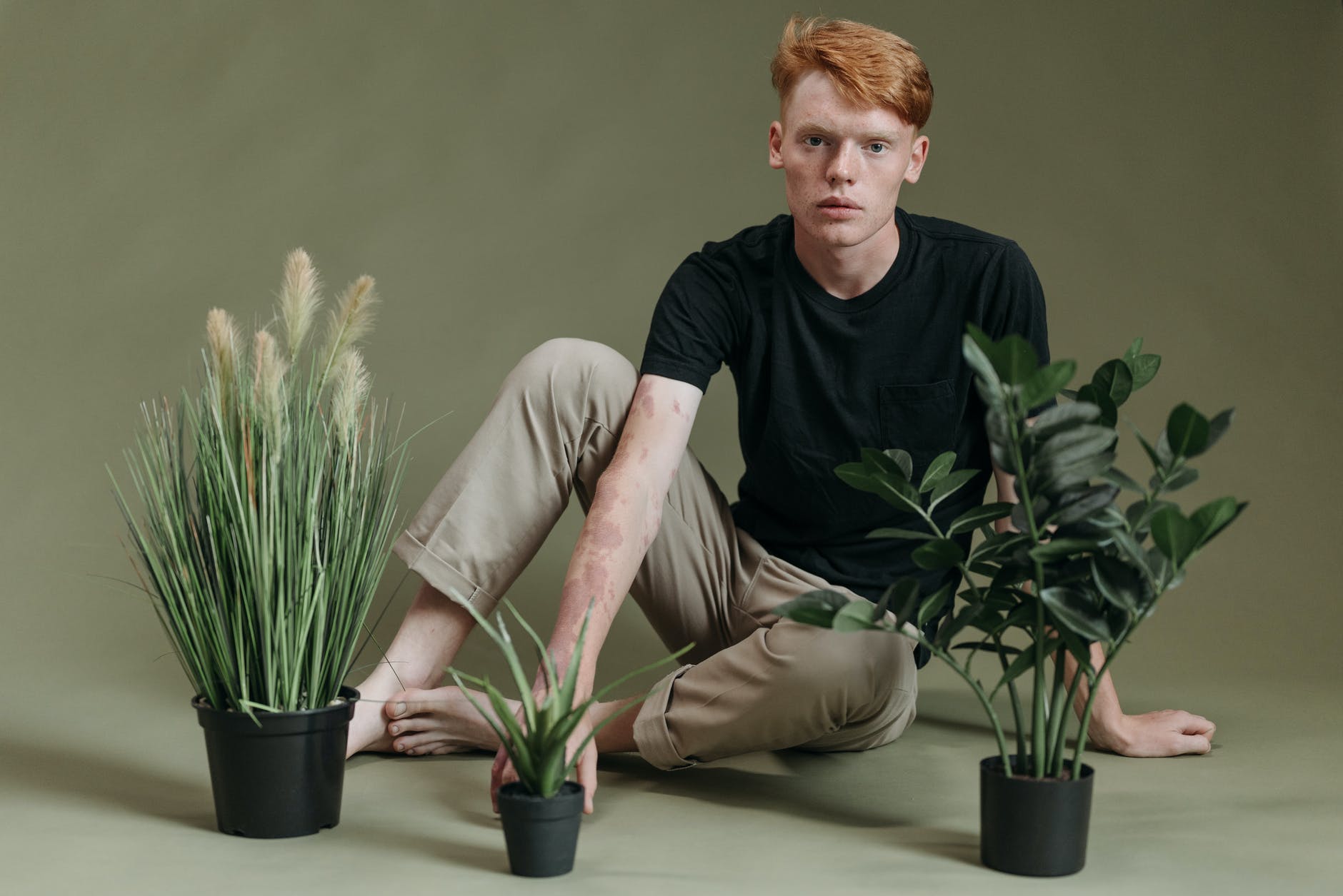 man sitting grass leaf