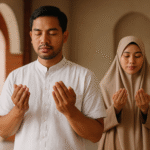 Pasangan Muslim Indonesia sedang berdoa di dalam masjid, pria mengenakan baju koko simpel warna putih dan wanita berhijab syar’i, suasana khusyuk untuk ibadah rutin.