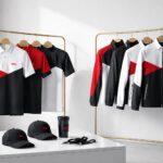 Seragam event instagrammable modern nuansa merah-hitam dengan cutting minimalis, kontras logo rapi, tampilan profesional untuk kebutuhan event dan promosi.